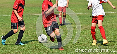 Kids are playing soccer Stock Photo