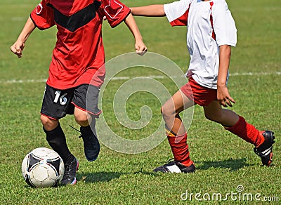 Kids are playing soccer Stock Photo