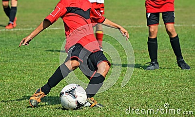 Kids are playing soccer Stock Photo