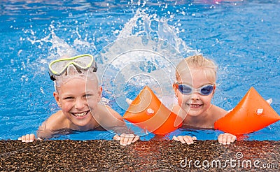 Kids playing in the swimming pool Stock Photo