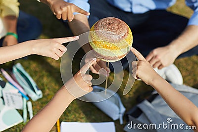 Kids Pointing at Planet in Outdoor Astronomy Lesson Stock Photo