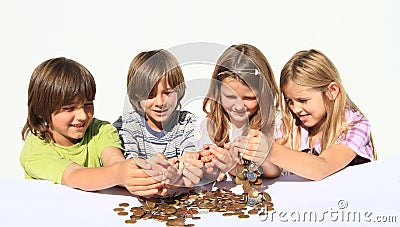 Kids pooring money thru hands Stock Photo