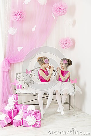 Kids with presents birthday party happy. Girl sisters playing Stock Photo