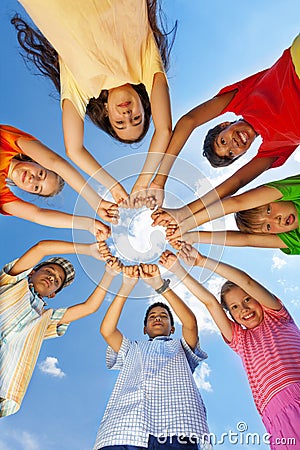 Kids put arms with claws straight in star shape Stock Photo