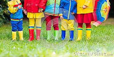 Kids in rain boots. Rubber boots for children. Stock Photo