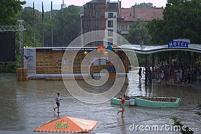 Kids on the rain street Editorial Stock Photo