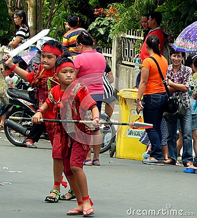 Kids in red traditional outfit performing warrior dance of Kabasaran Editorial Stock Photo