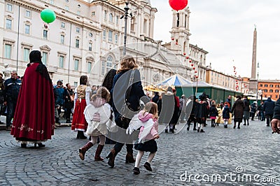 Kids running in street with angel dress in rome Editorial Stock Photo