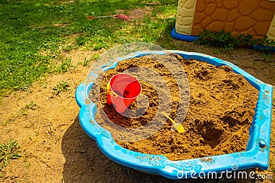 Kids sand playground toys on the grass Stock Photo
