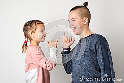 Kids show friendship and forgiveness, white background Stock Photo