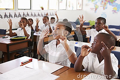 Kids showing hands during a lesson at an elementary school Stock Photo