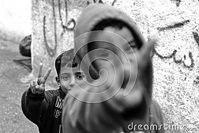 Kids showing peace sign in refugee camp Aida in Palestine Editorial Stock Photo