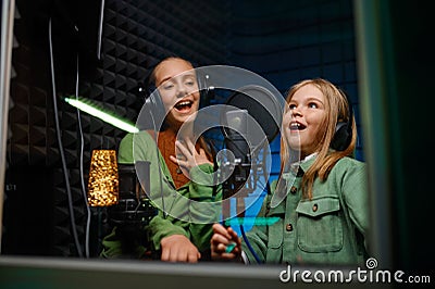 Kids singing in record studio Stock Photo