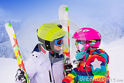 Kids skiing in the mountains Stock Photo