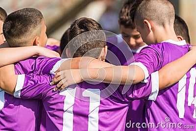 Kids soccer football - children players celebrating after victo Stock Photo