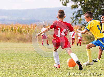 Kids soccer football - children players match on soccer field Editorial Stock Photo