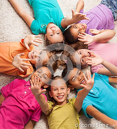 Kids in star shape laying on the florr Stock Photo