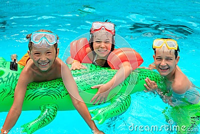 Kids in swimming pool Stock Photo