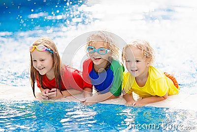 Kids in swimming pool. Children swim. Family fun Stock Photo