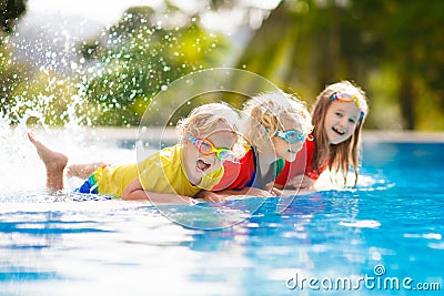 Kids in swimming pool. Children swim. Family fun Stock Photo