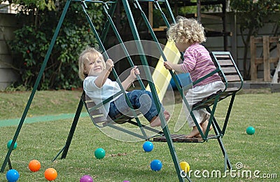 Kids on swing Stock Photo