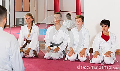 Kids taekwondo group ready to practice Stock Photo