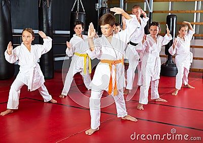 Kids at taekwondo workout, training attack movements Stock Photo