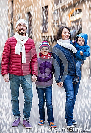 Kids with their parents walking Stock Photo