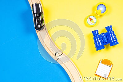 Kids toys summer vacation background with train, binoculars, compass Stock Photo