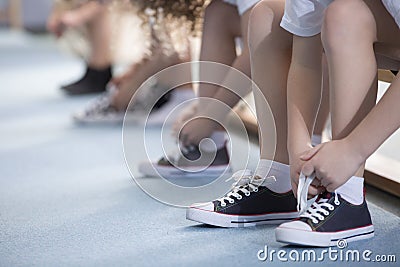 Kids tying sport shoes close-up Stock Photo