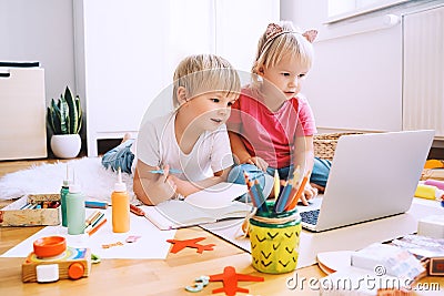 Kids using computer online technology to art creative, drawing or making crafts Stock Photo