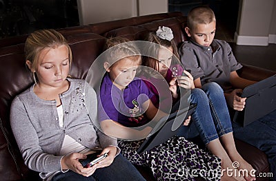 Kids using Mobile Devices Stock Photo