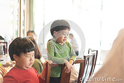 The chef is cutting the duck skin from the Beijing duck with a very sharp knife at a famous Chinese restaurant. Stock Photo