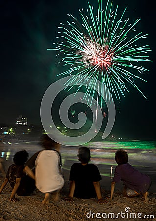 Kids watching the fireworks by the beach on new year eve Editorial Stock Photo