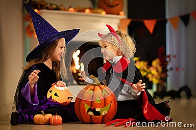 Kids in witch costume on Halloween trick or treat Stock Photo