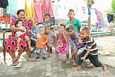 Kids with woman posing in Manado Editorial Stock Photo