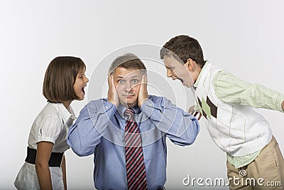 Kids yell into ears of dad Stock Photo