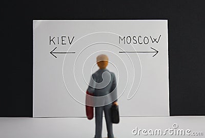 Kiev or Moscow way decision. Political metaphor Russia versus Ukraine conflict or travel choice concept Stock Photo