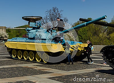 KIEV, UKRAINE - April 17, 2017: Children playing on the tank T 34, Motherland monument, April 17, 2017, Kiev, Ukraine Editorial Stock Photo