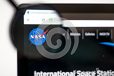 Kiev, Ukraine - april 6, 2019: Nasa homepage through a magnifying glass. NASA is the agency of the US government responsible for Editorial Stock Photo