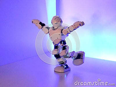 Small cyborg robots, humanoids with face and body dances to music Editorial Stock Photo