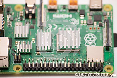 Kiev, Ukraine - August 13th, 2020: Single-board computer Raspberry Pi 4 with cooling radiators glued to the processor and Editorial Stock Photo