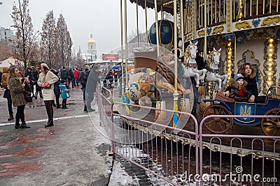 Kiev, Ukraine - December 30, 2018: Festive merry-go-round near Mikhailovskaya Square Editorial Stock Photo