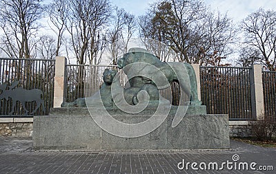 A sculpture of a lion and a lioness at the entrance to the Kiev Zoo. Editorial Stock Photo