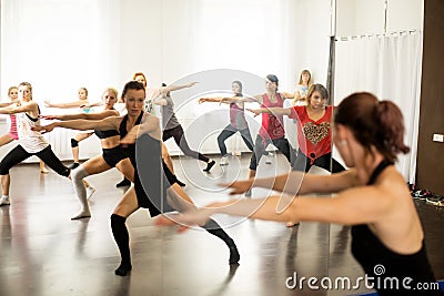 Kiev. Ukraine. 06.20.2018. Group portrait of girls with female choreographer doing interest position in the modern dance studio Editorial Stock Photo