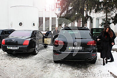 Kiev, Ukraine; January 20, 2014. Bentley Continental Flying Spur and Volkswagen Touareg. Security Editorial Stock Photo