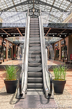 Kiev, Ukraine - July 6, 2019: Escalator Elevator Stairs Lift in Outlet Village called Manufaktura Shoping Center Looks Like Editorial Stock Photo