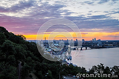 Kiev, Ukraine - July 4, 2019: Panorama of city Kiev, observation deck on the Dnipro, sunset sky in the background forms Editorial Stock Photo