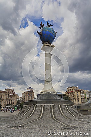 Kiev, Ukraine - July 02, 2017: Statue of a blue terrestrial globe with doves of peace around it in Independence square Editorial Stock Photo