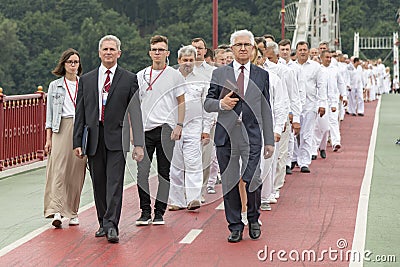 Kiev, Ukraine. July 22 2018 Two shepherds lead a column of believers in white robes for water baptism. The column of converts of C Editorial Stock Photo